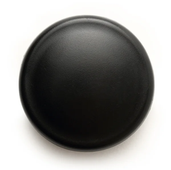 Schwarzer Knopf auf weißem Hintergrund — Stockfoto
