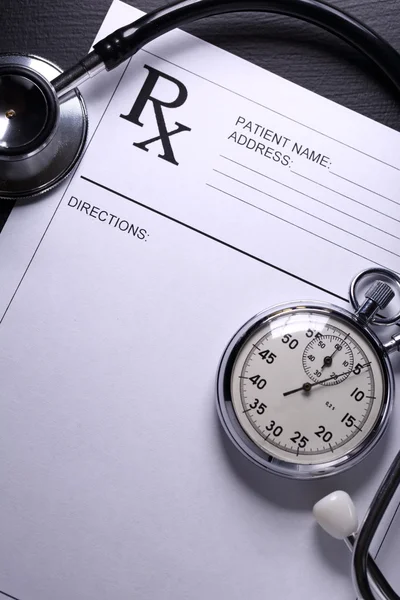 Stethoscope, stopwatch and patient list on white — Stock Photo, Image