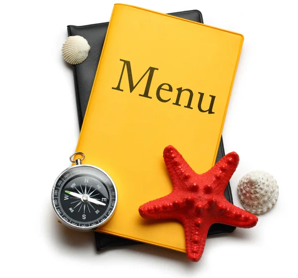 Gele menu boek, seastar en schelpen — Stockfoto