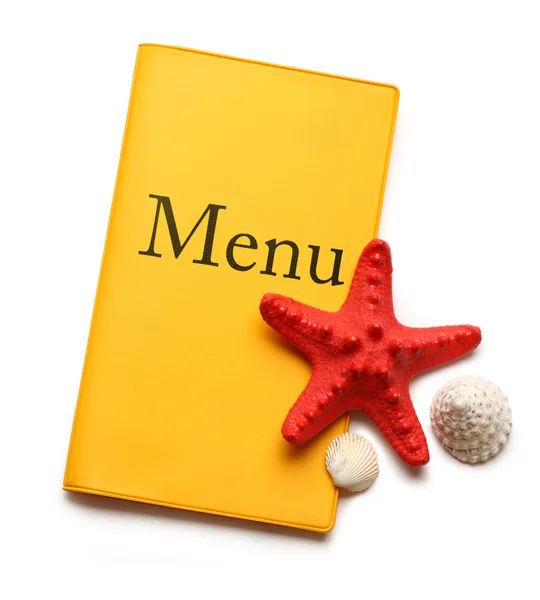 Livro de menu amarelo, litoral e conchas — Fotografia de Stock