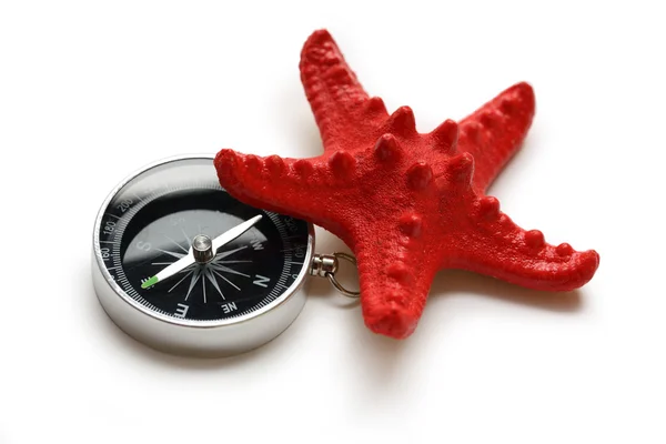 Kompas i czerwona gwiazda morza — Zdjęcie stockowe