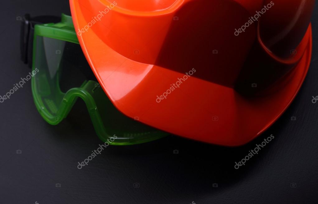 Red safety helmet with goggles on black Stock Photo by ©Garsya 23279710