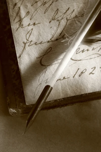 Old book with feather pen — Stock Photo, Image