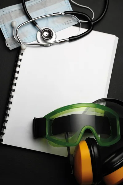 Stethoscope, mask, goggles and earphones — Stock Photo, Image
