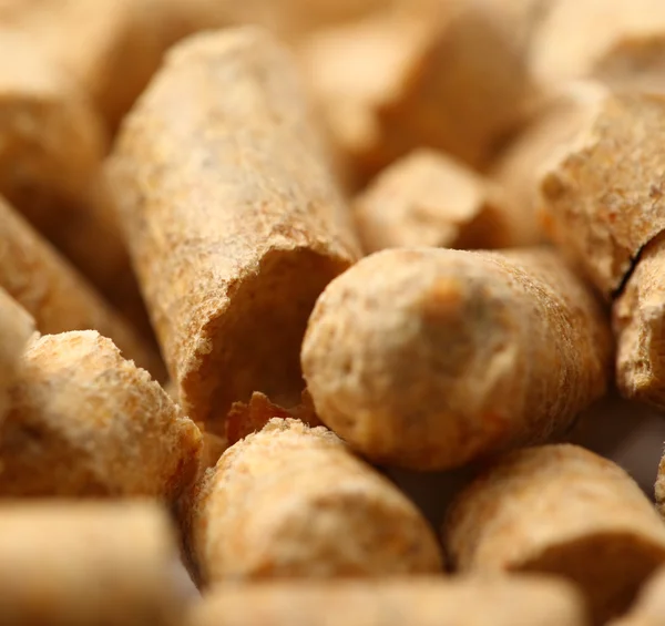 Wooden pellets closeup background — Stock Photo, Image