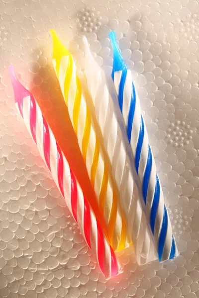 Bright candles on foam plastic — Stock Photo, Image