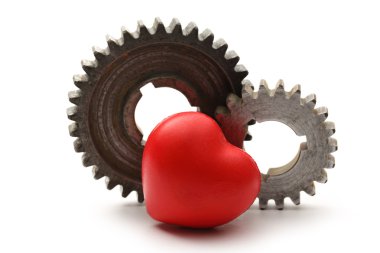 Çelik cogwheels ve kırmızı kalp