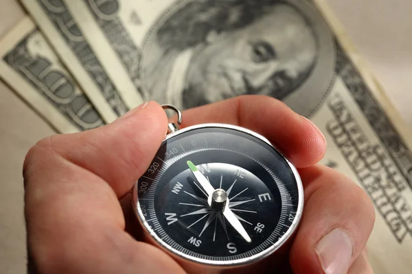 Hand holding silver black compass — Stock Photo, Image