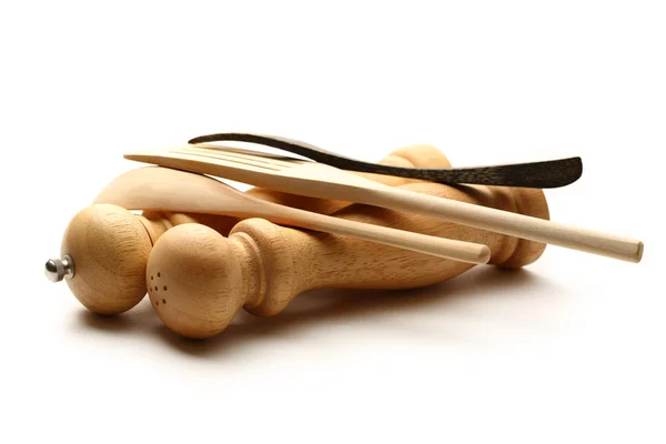 Wooden salt and pepper set with kitchen utensils — Stock Photo, Image