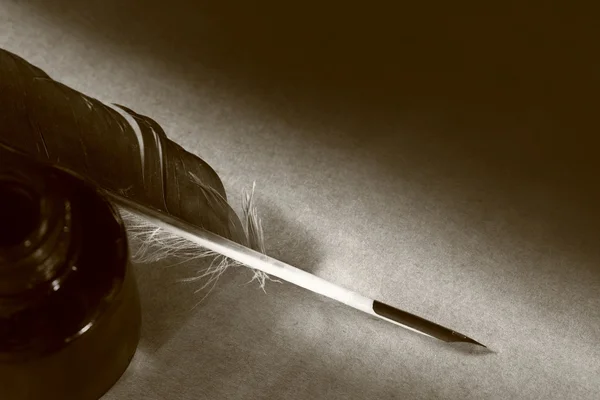 Feather with the bottle full of ink — Stock Photo, Image