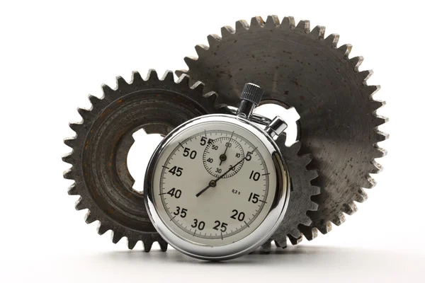 Three steel cogwheels and stopwatch — Stock Photo, Image