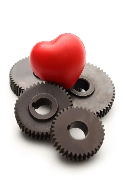 Steel cogwheels and red heart — Stock Photo, Image