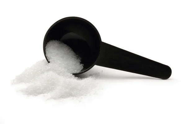Bílá sůl granulovaná s lžící — Stock fotografie