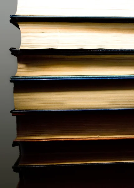 Stack of books isolated on the black background — Stock Photo, Image