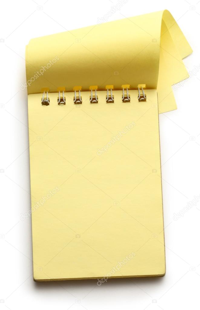 Open yellow notepad on white