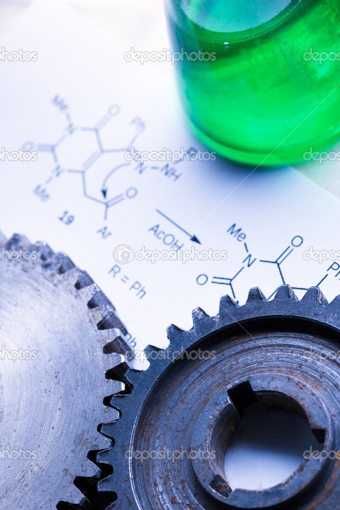 Chemistry formula with green flask and mechanical cogwheels