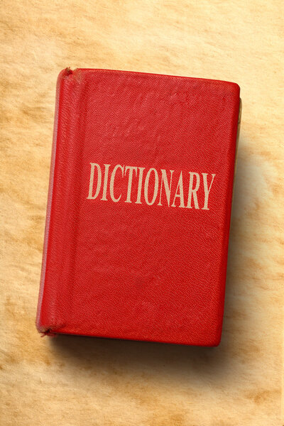 Старый словарь на бумажном фоне

