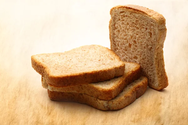 Krajíce chleba na pozadí — Stock fotografie