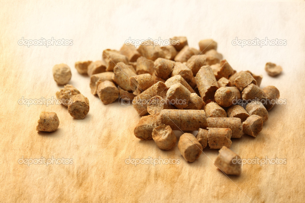 Wooden pellets on paper background