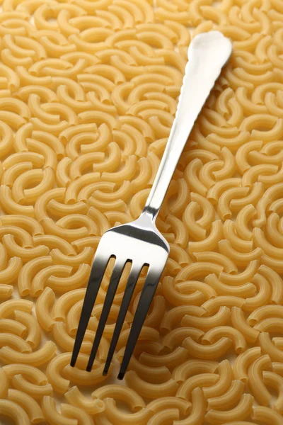 Sfondo tubi pasta con forchetta — Foto Stock