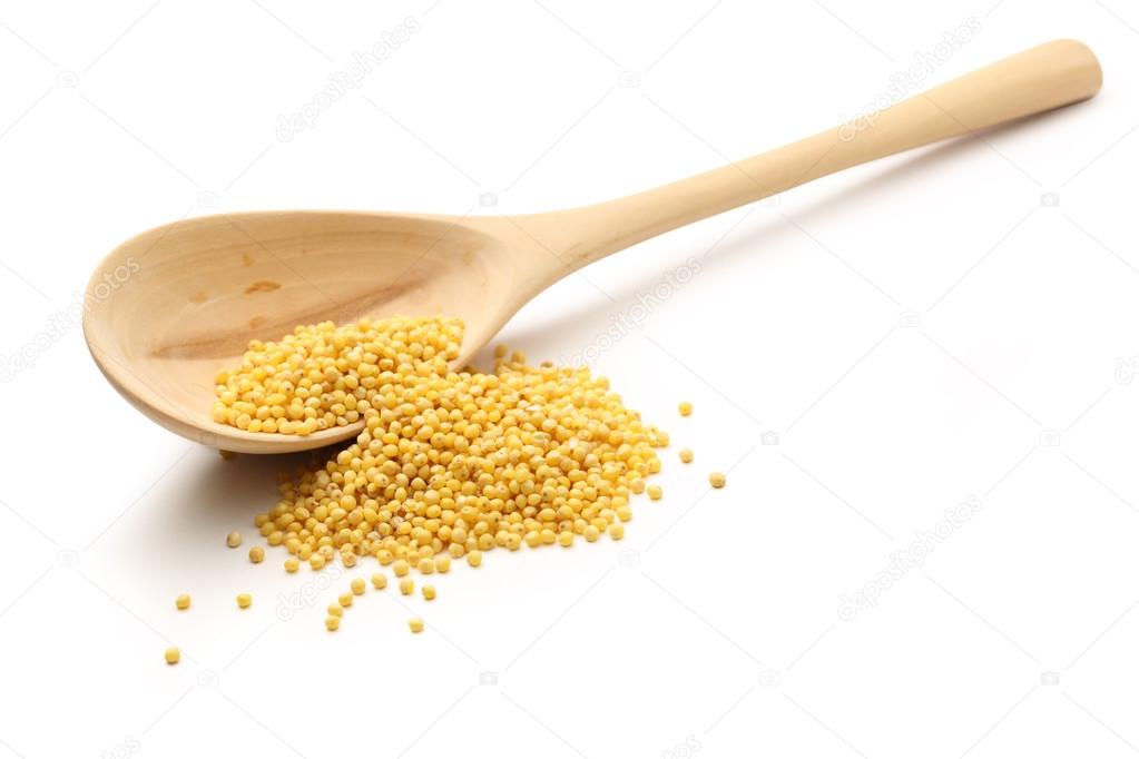 Millet groats with wooden spoon Stock Photo by ©Garsya 34925237