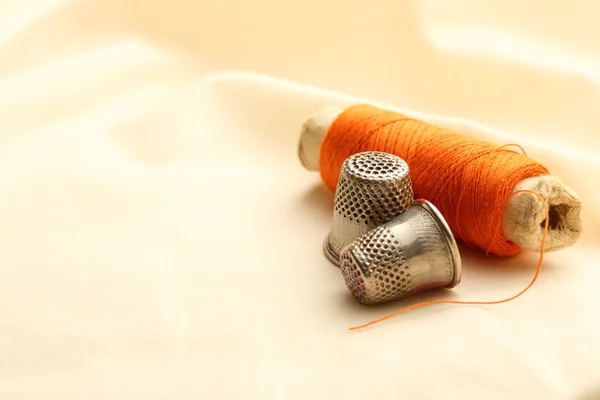 Thimbles and needle — Stock Photo, Image