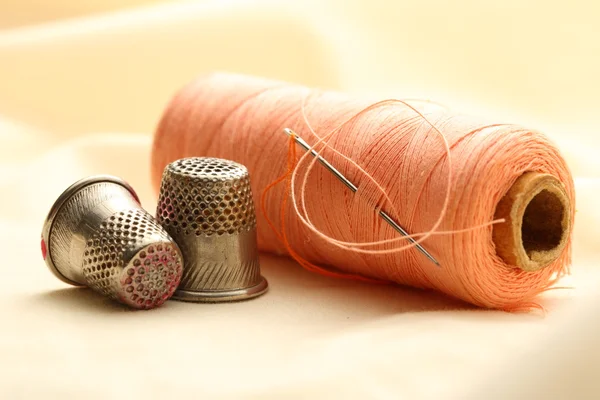 Thimbles and needle — Stock Photo, Image