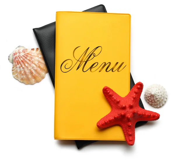 Seashells on menu book — Stock Photo, Image