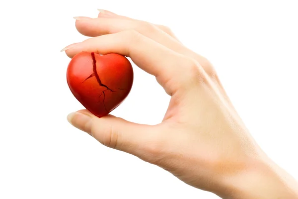 Broken red heart in hand — Stock Photo, Image