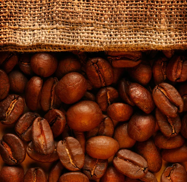 Coffee beans with sack — Stock Photo, Image