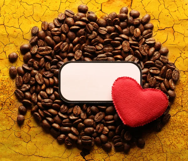 Coffee beans with label and heart — Stock Photo, Image