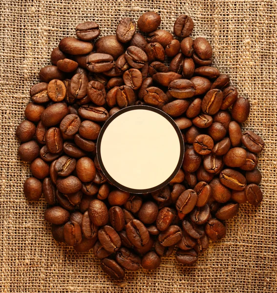 Brown coffee beans with label — Stock Photo, Image