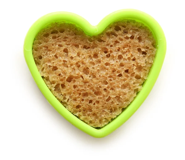 Slice of bread in heart — Stock Photo, Image