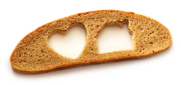 Sneetje brood in huis en hart vorm — Stockfoto