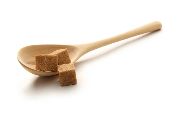 Cane sugar with wooden spoon — Stock Photo, Image