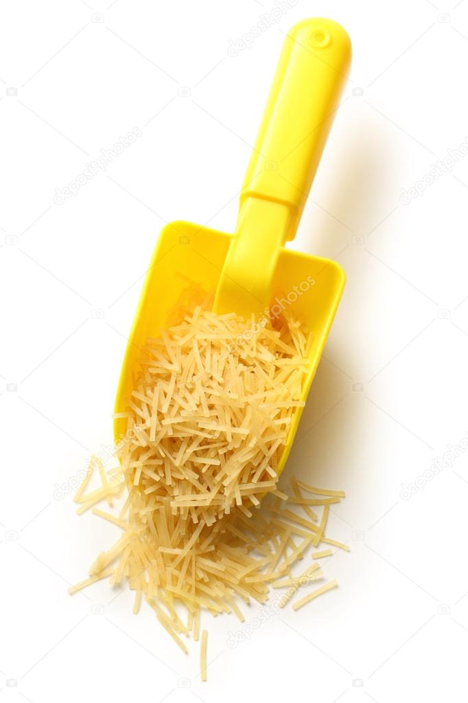 Short pasta in yellow spoon