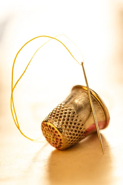 Sewing thimble and needle — Stock Photo, Image