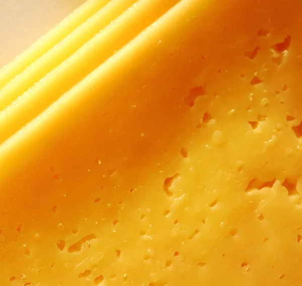 Yellow cheese background Royalty Free Stock Photos