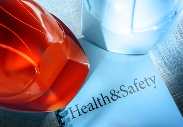 Health and safety with helmets — Stock Photo, Image
