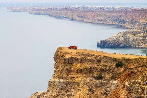 Red Car High Cliff Royalty Free Stock Images