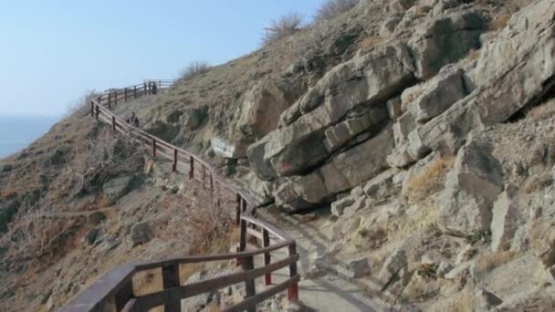 Walking along mountain path. Golitsyn trail, Crimea — стоковое видео