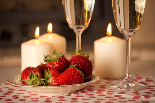 Champagne, strawberries and candles. — Stock Photo, Image