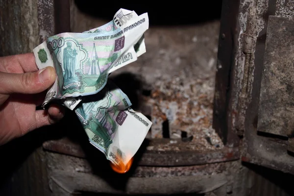 Money burning in the furnace