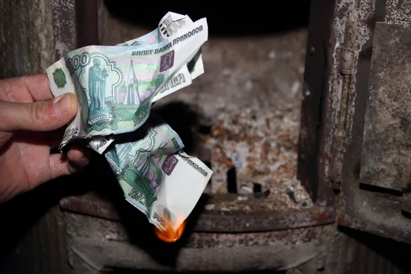 Pénz égető kemencében Stock Kép
