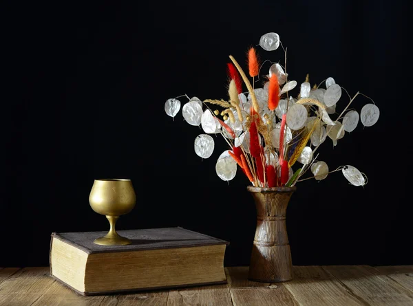 Book and dried flowers — Stock Photo, Image