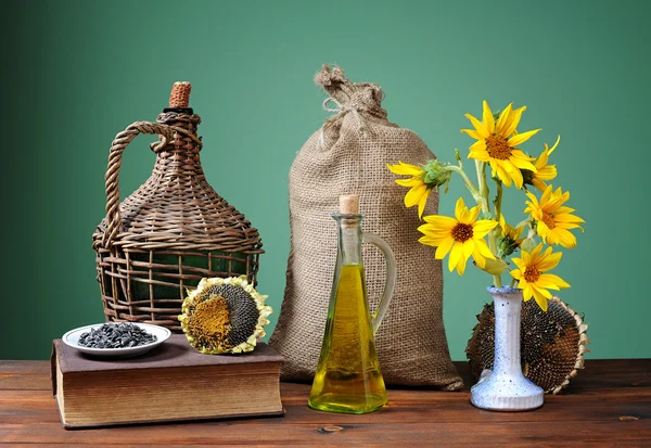 Sunflowers in a vase and a sack of jute — Stock Photo, Image