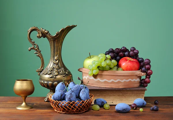 Plums , and metal carafe — Stock Photo, Image