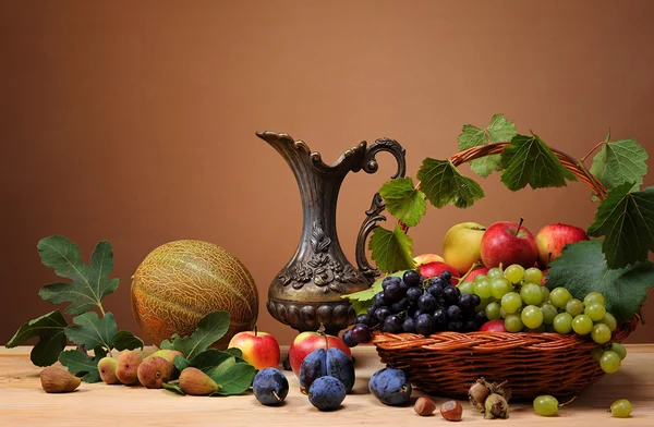 Fresh fruit and melon beside the metal jug — Stock Photo, Image