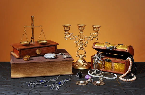 Jewelry boxes, books and candlestick — Stock Photo, Image