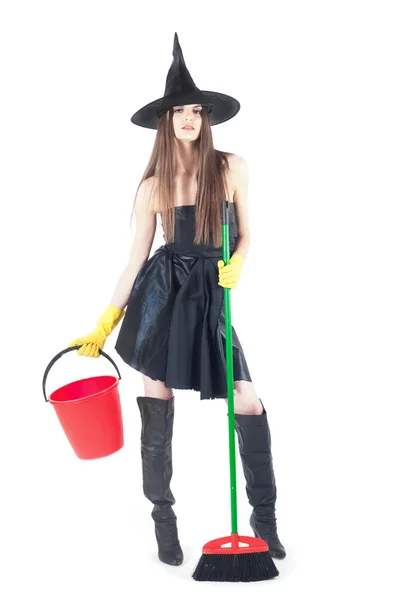 Beautiful witch doing the cleaning — Stock Photo, Image